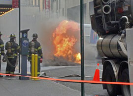 Firemen acting against manhole fire at the city